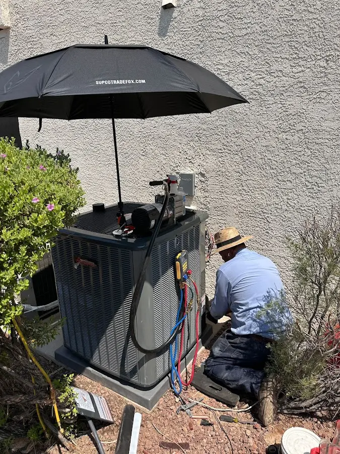 HVAC technician performing outdoor AC maintenance in Tampa